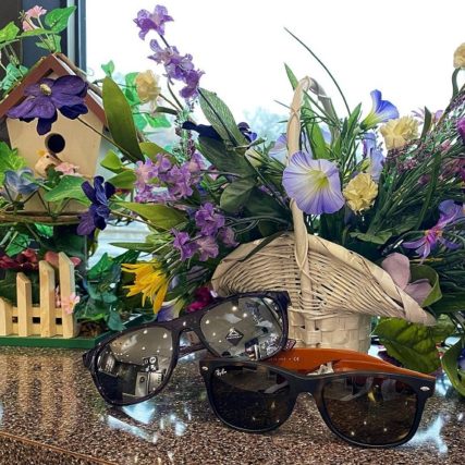RayBan sunglasses display with flowers